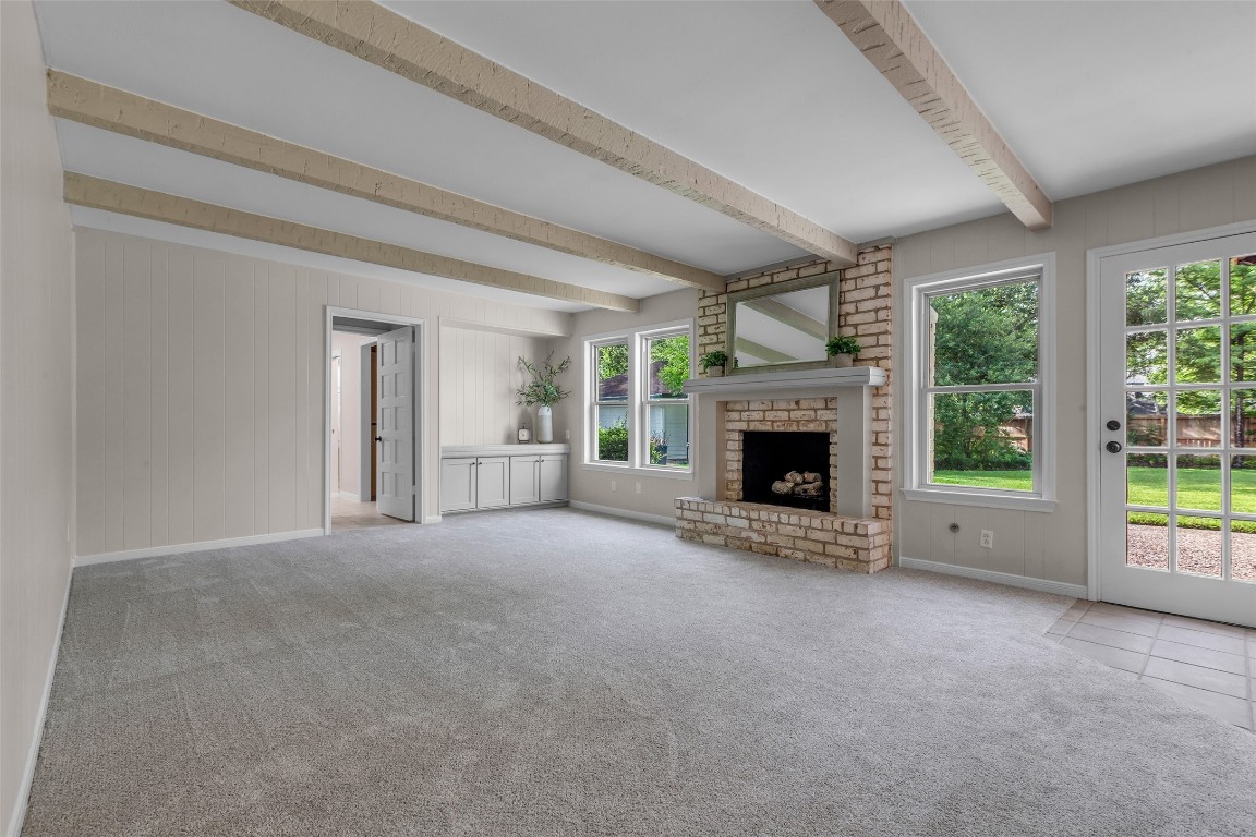 6415 Bayonne Drive Spring, TX 77389 - Photo 6 of 40 a view of an empty room with a fireplace and a window