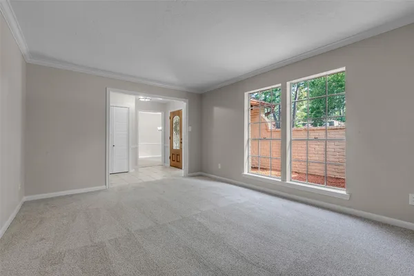 a view of an empty room with a window