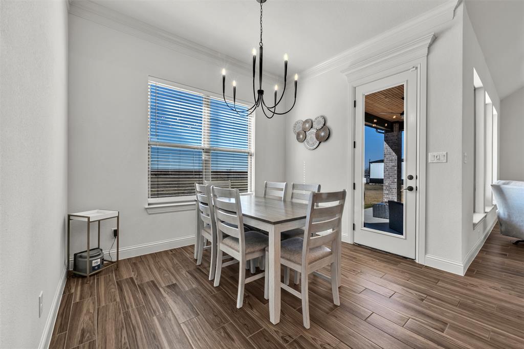 6632 Buffalo Ridge Circle Godley, TX 76044 - Photo 13 of 37 a view of a dining room with furniture window and wooden floor