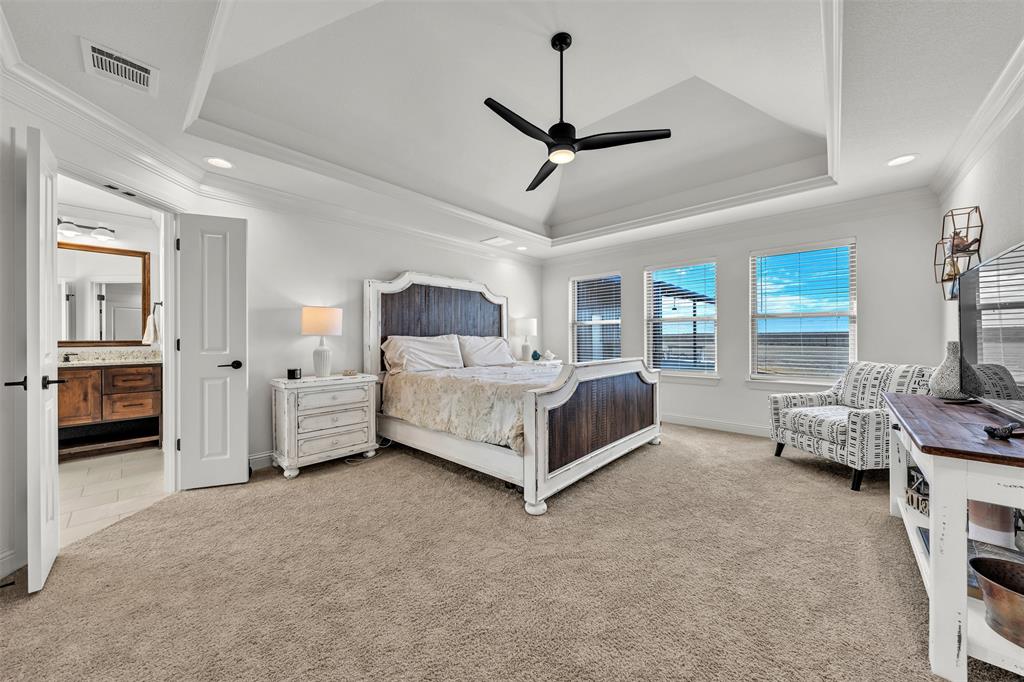 6632 Buffalo Ridge Circle Godley, TX 76044 - Photo 15 of 37 a bed room with furniture and a chandelier