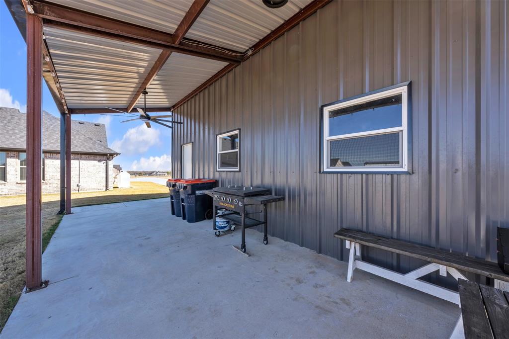 6632 Buffalo Ridge Circle Godley, TX 76044 - Photo 29 of 37 a view of a porch with furniture and floor to ceiling window