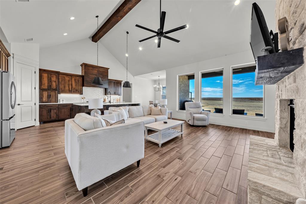 6632 Buffalo Ridge Circle Godley, TX 76044 - Photo 7 of 37 a living room with furniture kitchen view and a wooden floor