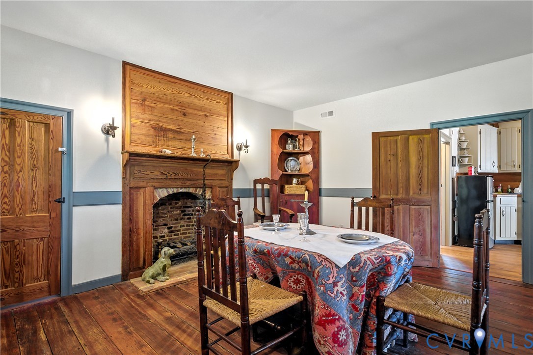 11826 Colonial Trail West Spring Grove, VA 23881 - Photo 13 of 42 a view of a dining room with furniture window and wooden floor