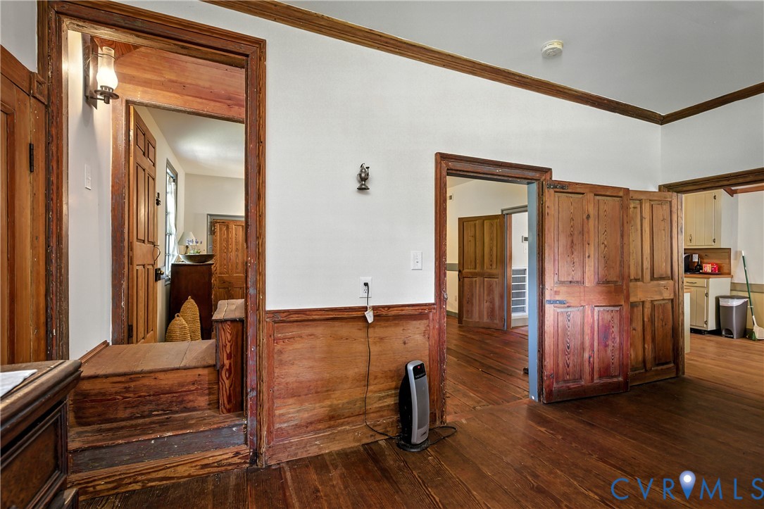 11826 Colonial Trail West Spring Grove, VA 23881 - Photo 18 of 42 a view of a hallway with entryway wooden floor and front door