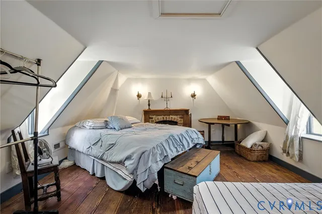 a bedroom with a bed and a ceiling fan