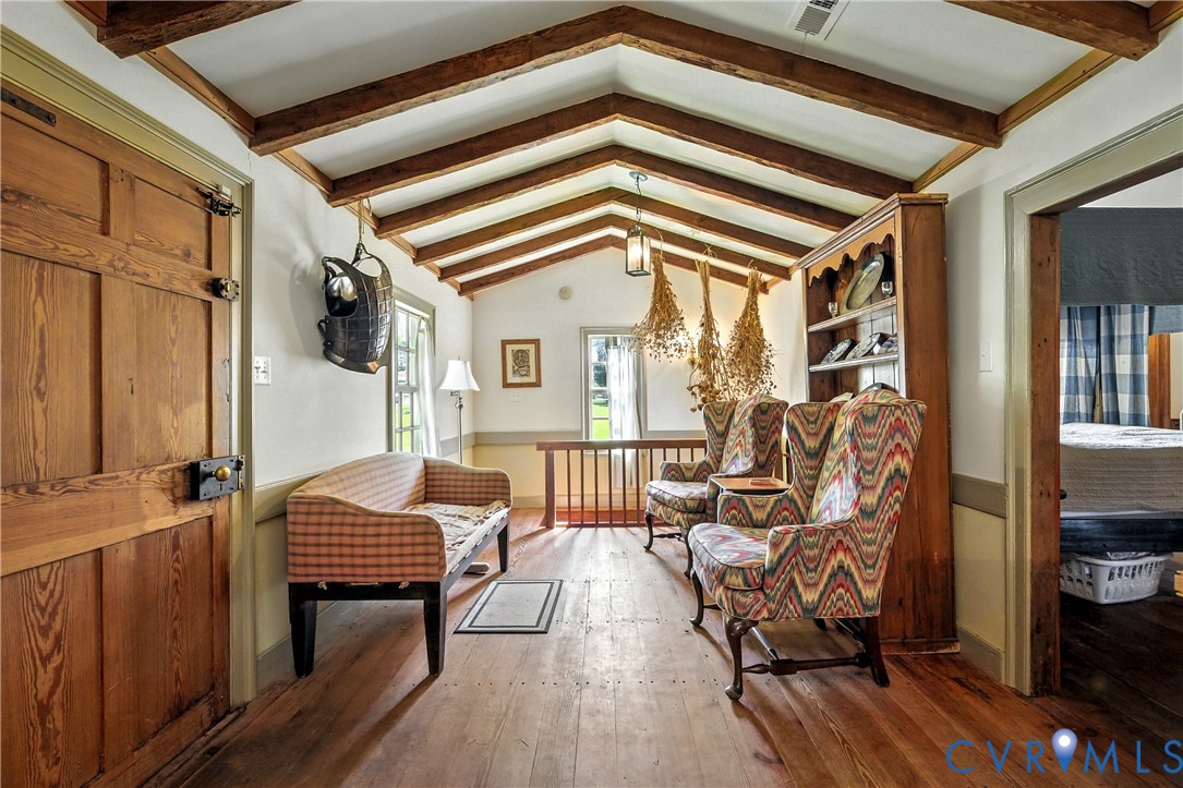 11826 Colonial Trail West Spring Grove, VA 23881 - Photo 26 of 42 a view of a balcony with furniture and wooden floor