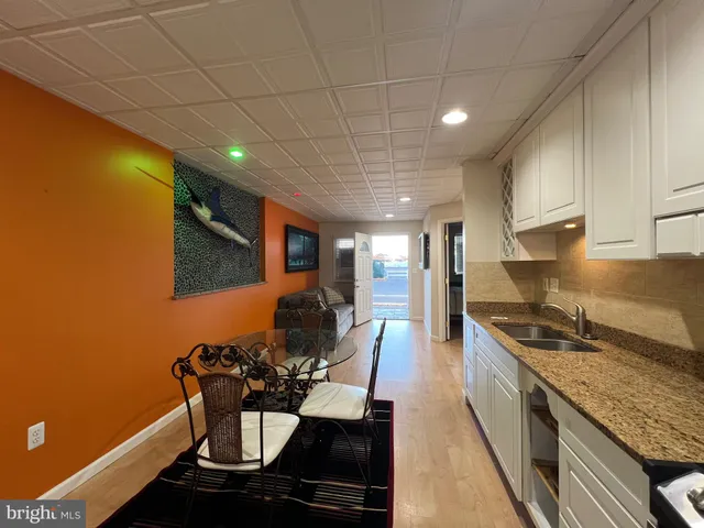 a kitchen with stainless steel appliances granite countertop a sink and cabinets