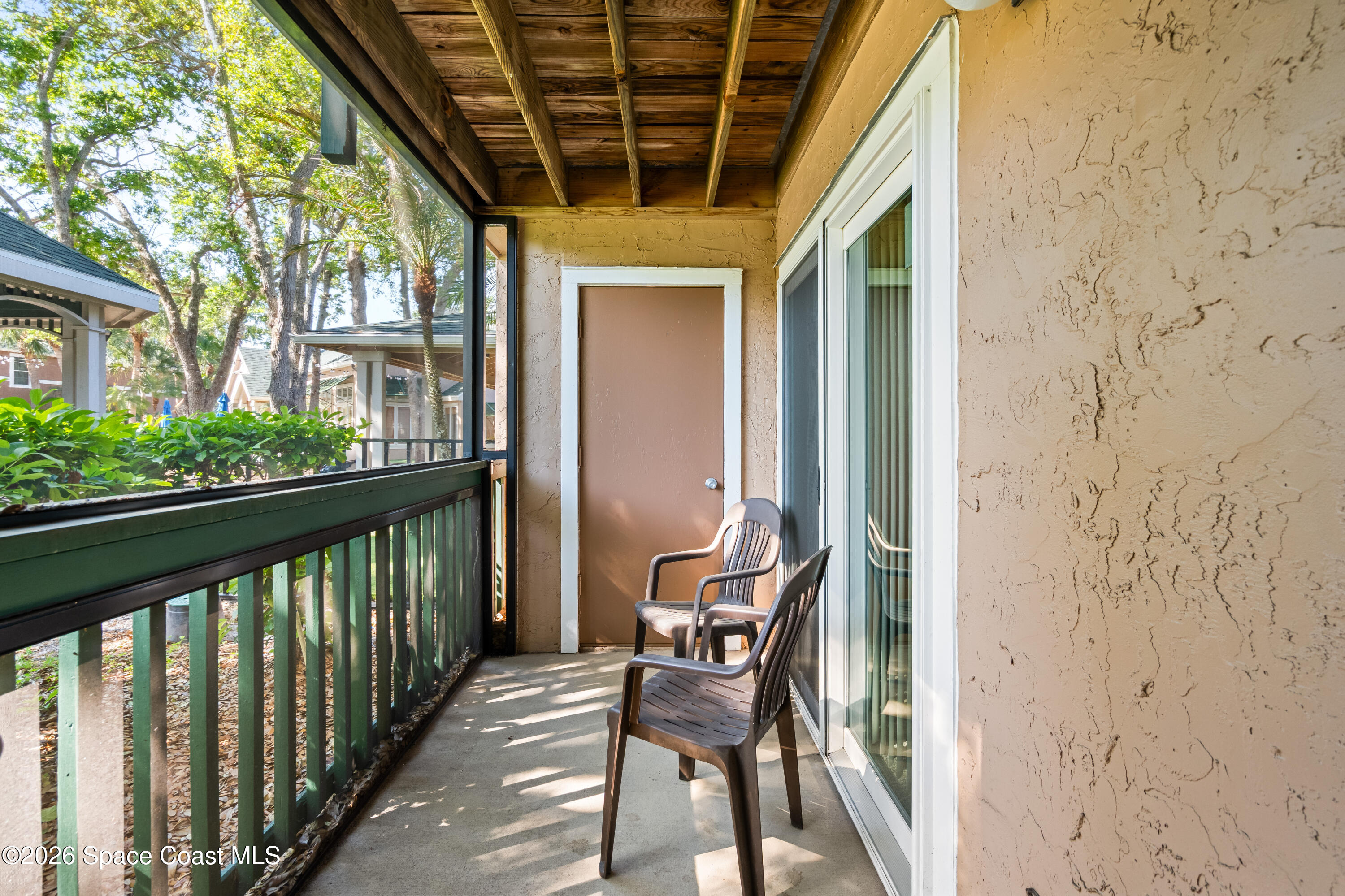 7667 North Wickham Road, Unit 208 Melbourne, FL 32940 - Photo 19 of 33 a view of a balcony with furniture