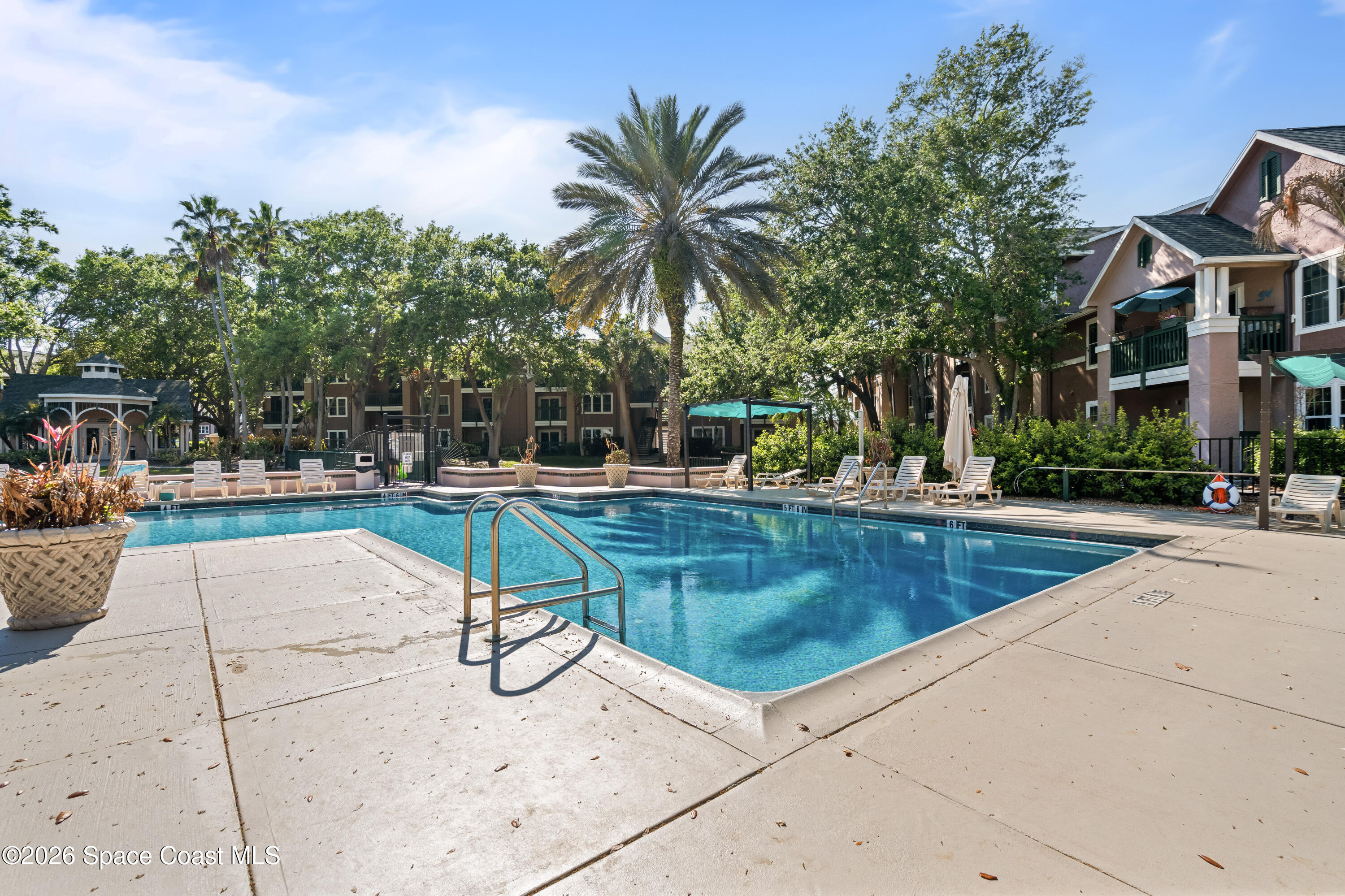 7667 North Wickham Road, Unit 208 Melbourne, FL 32940 - Photo 25 of 33 a view of swimming pool with outdoor seating and plants