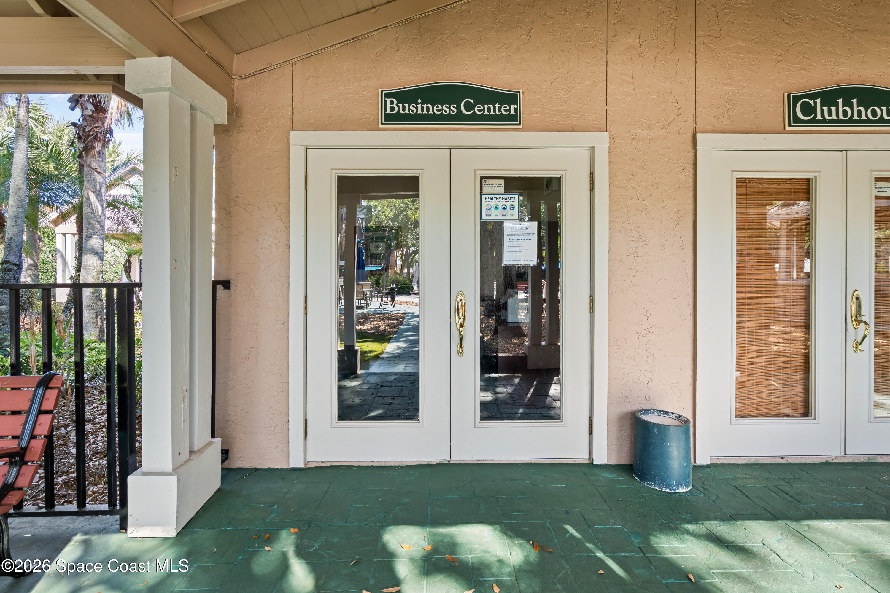 7667 North Wickham Road, Unit 208 Melbourne, FL 32940 - Photo 27 of 33 a front view of a house with garden