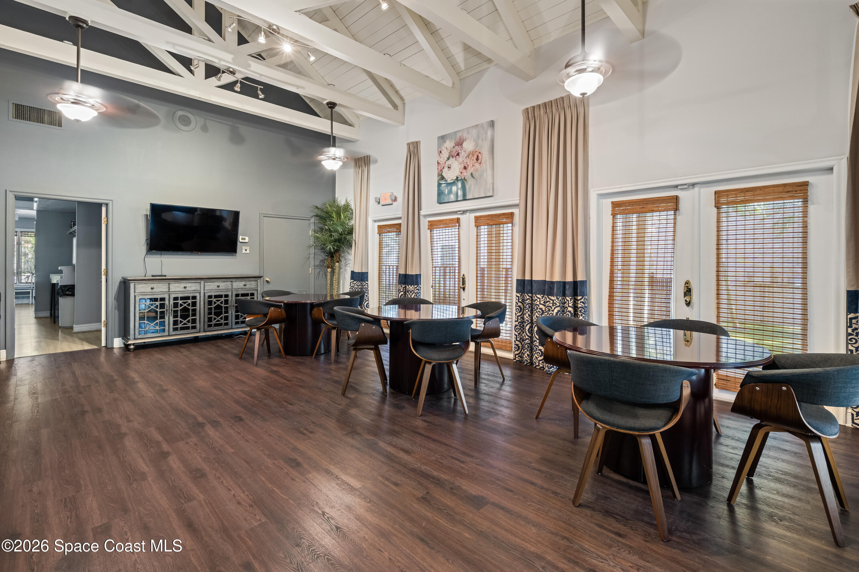 7667 North Wickham Road, Unit 208 Melbourne, FL 32940 - Photo 28 of 33 a living room with furniture and a flat screen tv