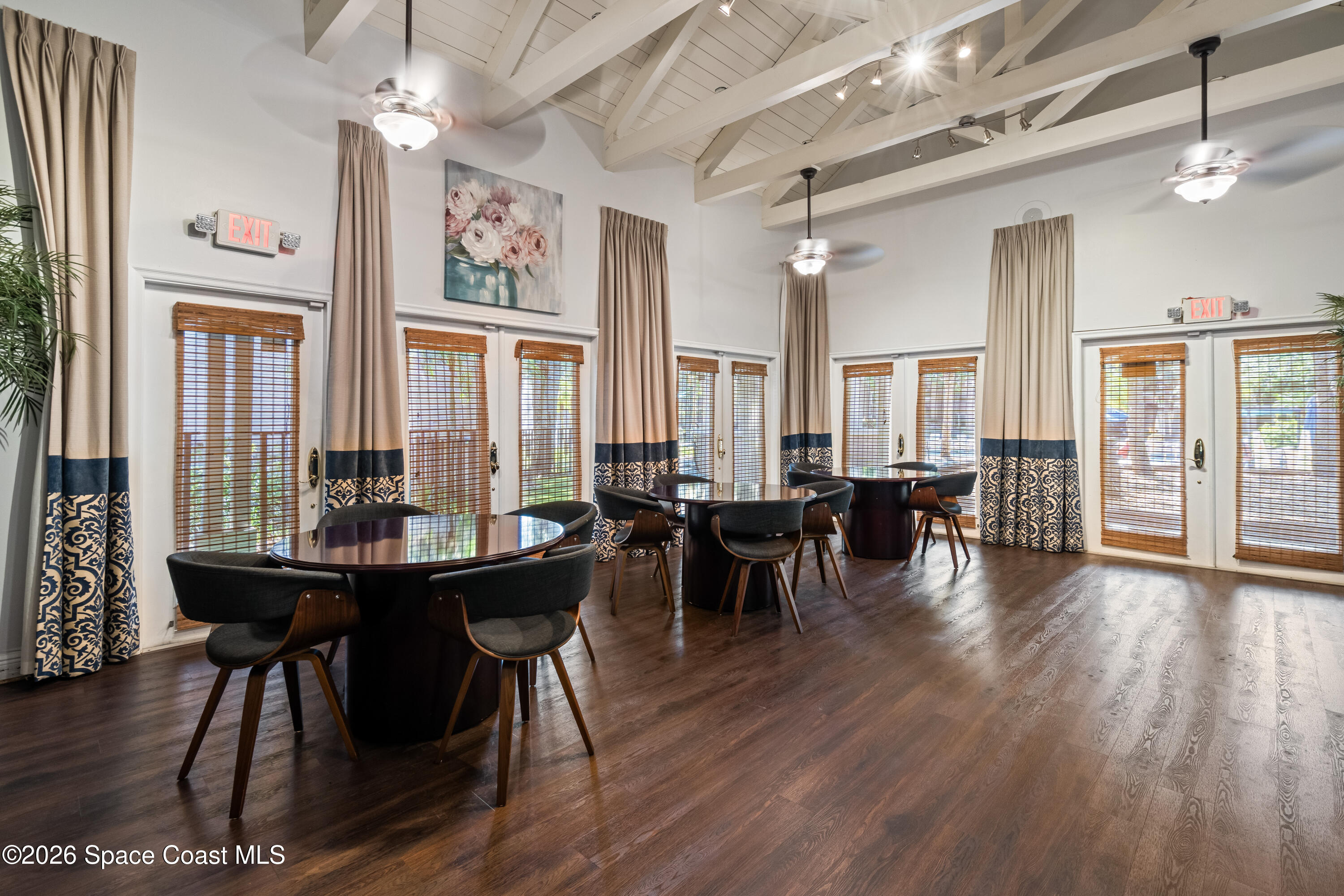 7667 North Wickham Road, Unit 208 Melbourne, FL 32940 - Photo 29 of 33 a view of a dining room with furniture window and wooden floor