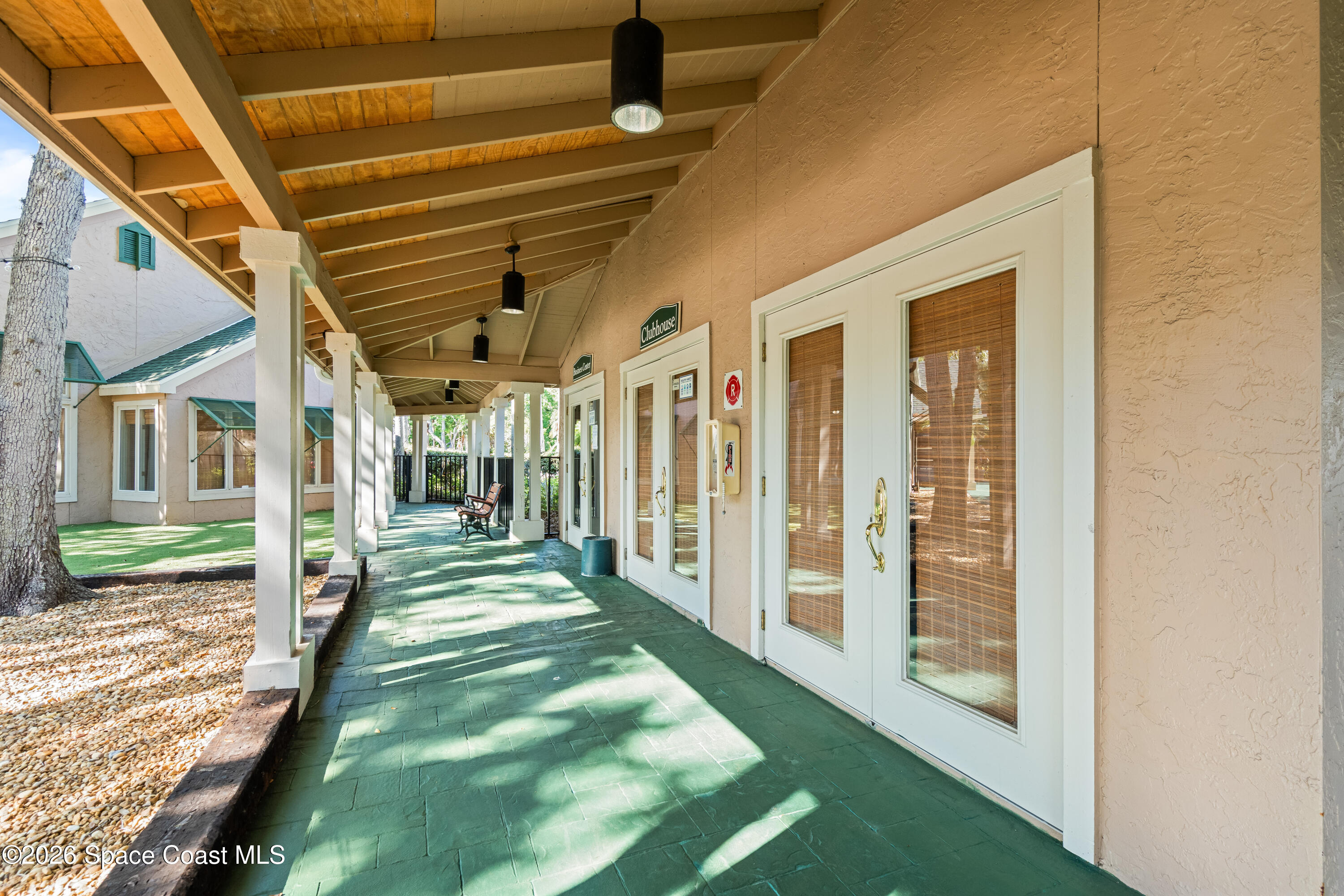 7667 North Wickham Road, Unit 208 Melbourne, FL 32940 - Photo 31 of 33 a view of a porch with a table and chairs