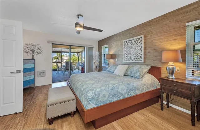 a bedroom with a large bed and a window