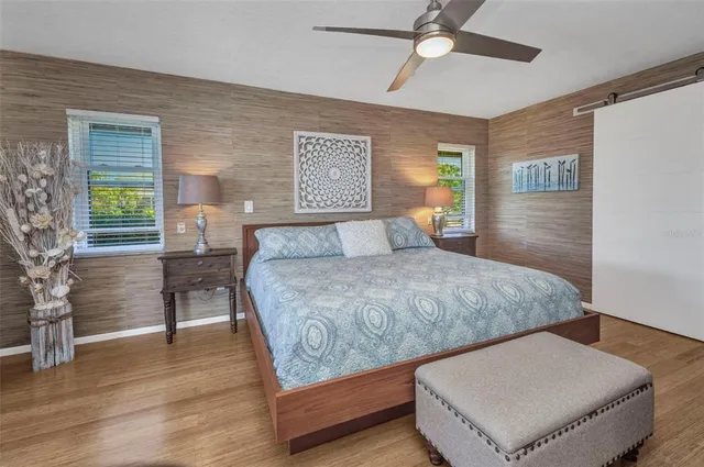 a bathroom with a sink a mirror and shower