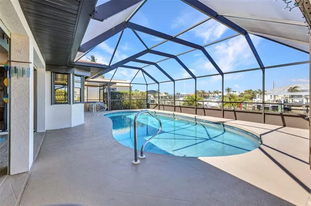 a room with pool table and a floor to ceiling window