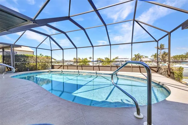 a view of an house with backyard space and balcony