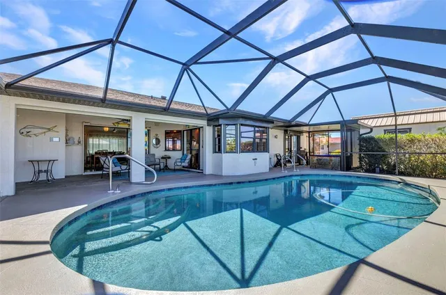 a view of a lake with a table and chairs