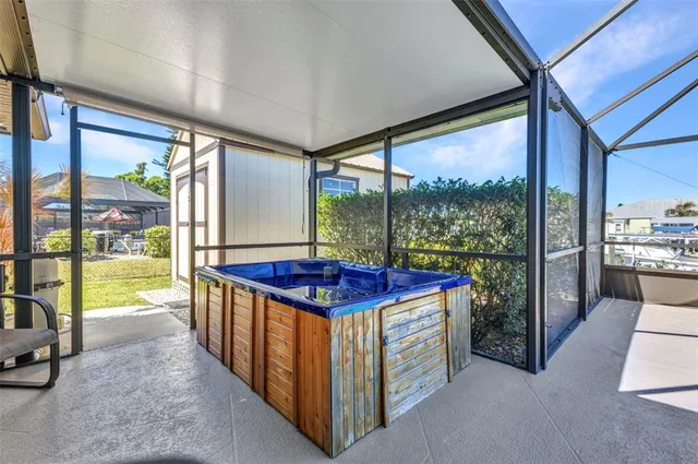 a view of a chairs and table in patio