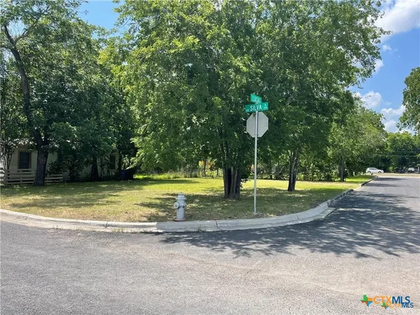 a view of a playground with basketball court