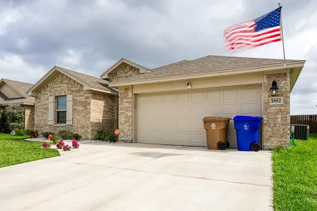 a front view of a house with yard