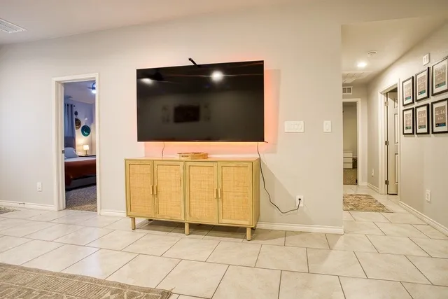 a view of a livingroom with furniture and an entryway