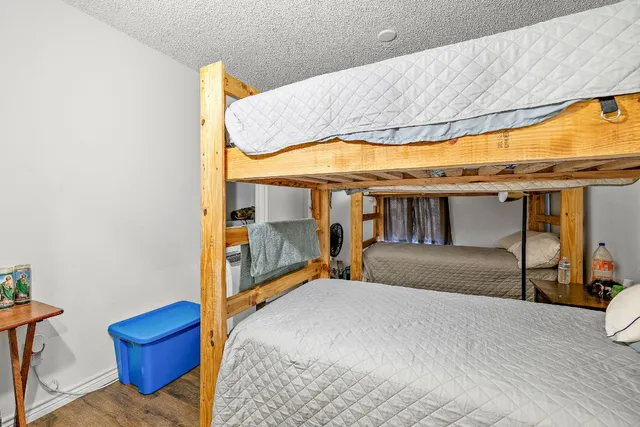 a bedroom with a bed and window