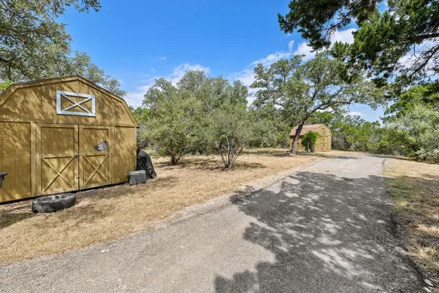 a view of a outdoor space with wooden fence