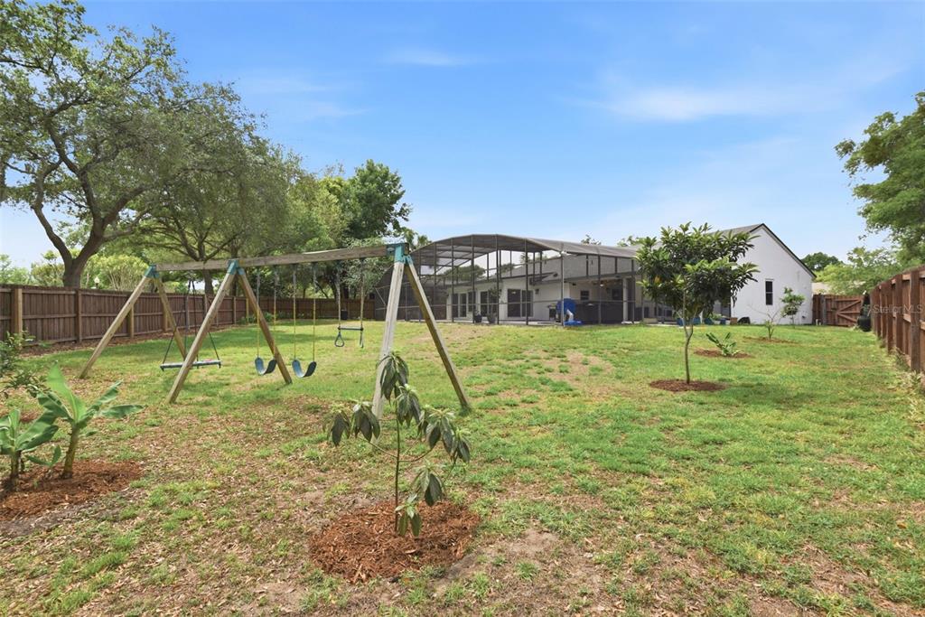 7432 Sparkling Lake Road Orlando, FL 32819 - Photo 39 of 54 a view of a park with a slide