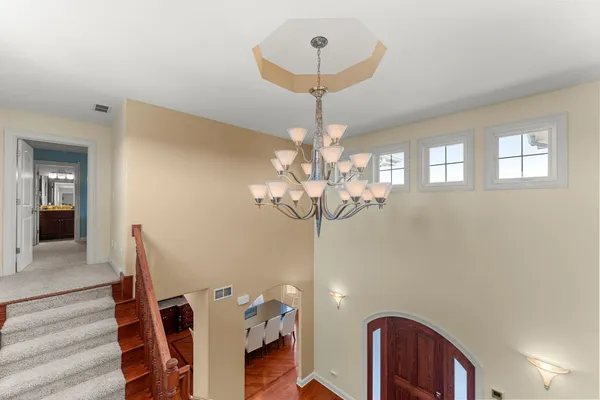 a spacious bedroom with a bed and a large window