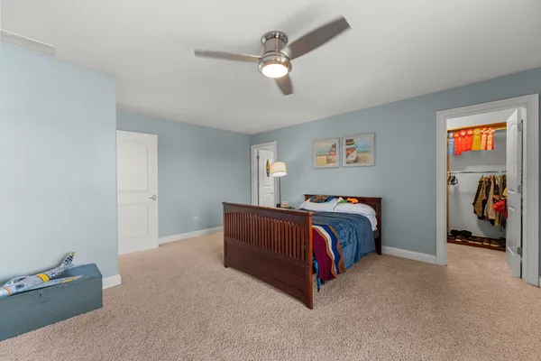 a living room with a flat screen tv and appliances