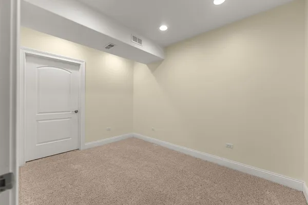 a bathroom with a granite countertop sink toilet a mirror and shower