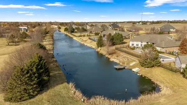a living room with furniture fireplace and flat screen tv