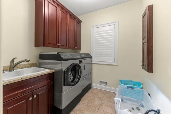 a view of a building with snow on the road