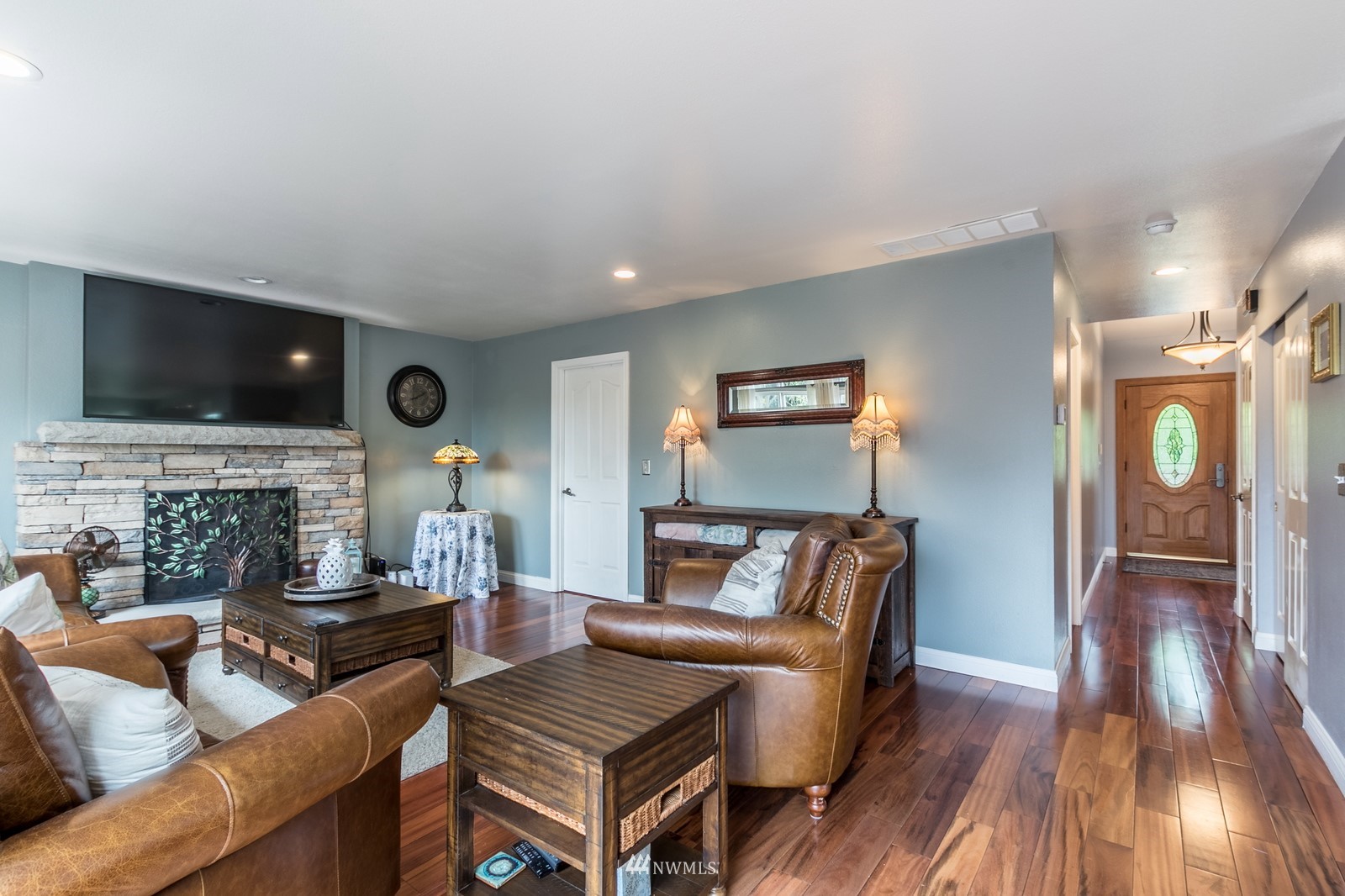 7413 Vandermark Road East Bonney Lake, WA 98391 - Photo 16 of 39 a living room with furniture and a flat screen tv
