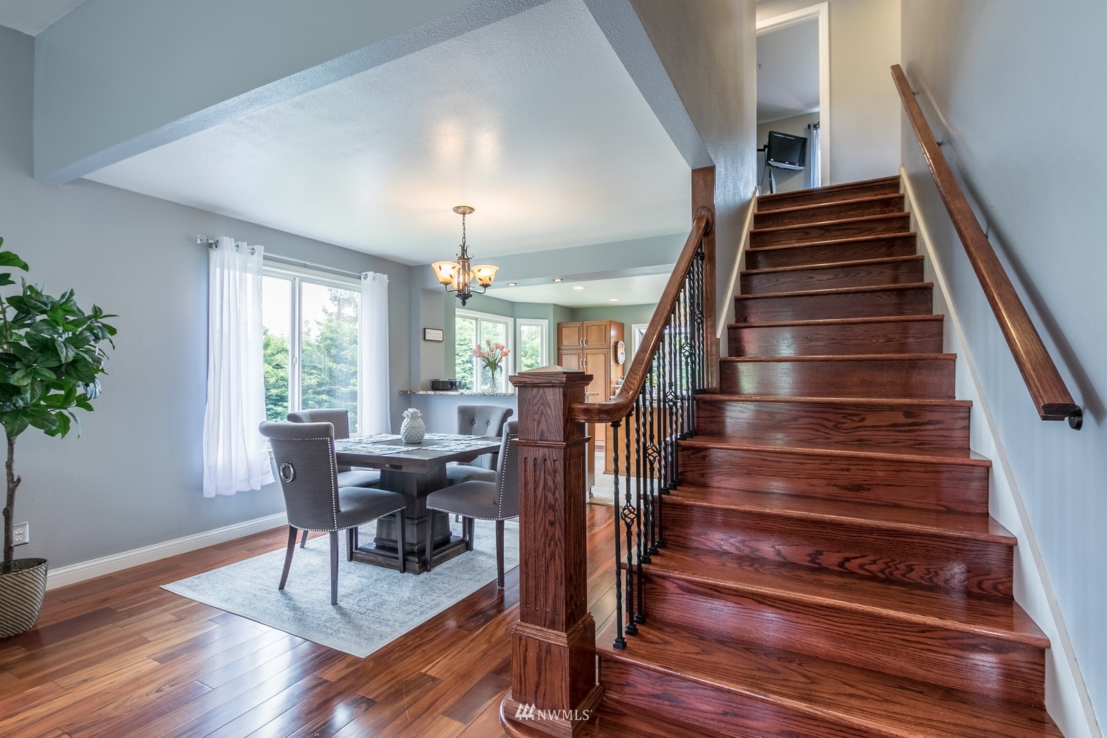 7413 Vandermark Road East Bonney Lake, WA 98391 - Photo 18 of 39 a view of a dining room with furniture and wooden floor