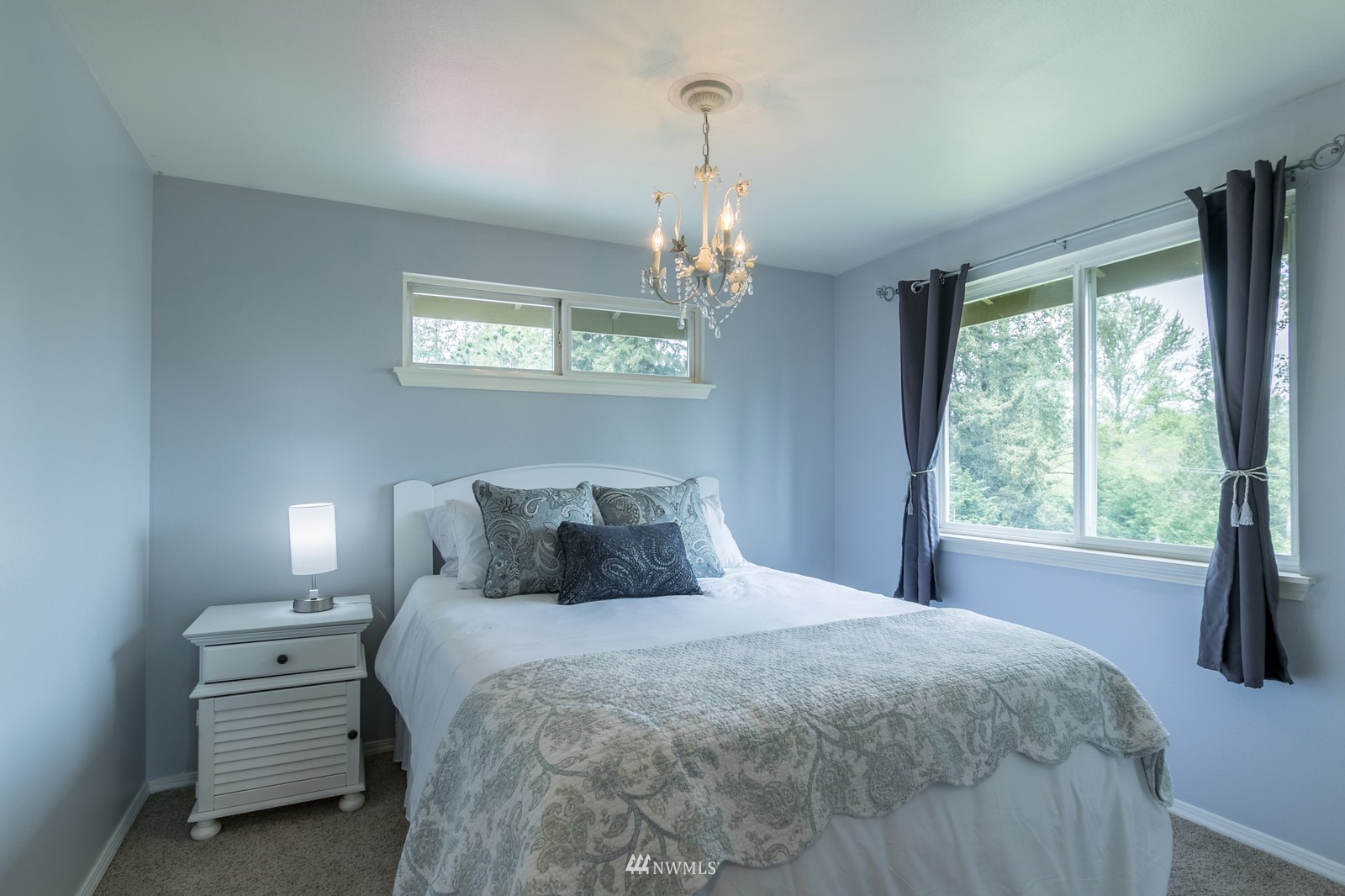 7413 Vandermark Road East Bonney Lake, WA 98391 - Photo 25 of 39 a bedroom with a bed and a window