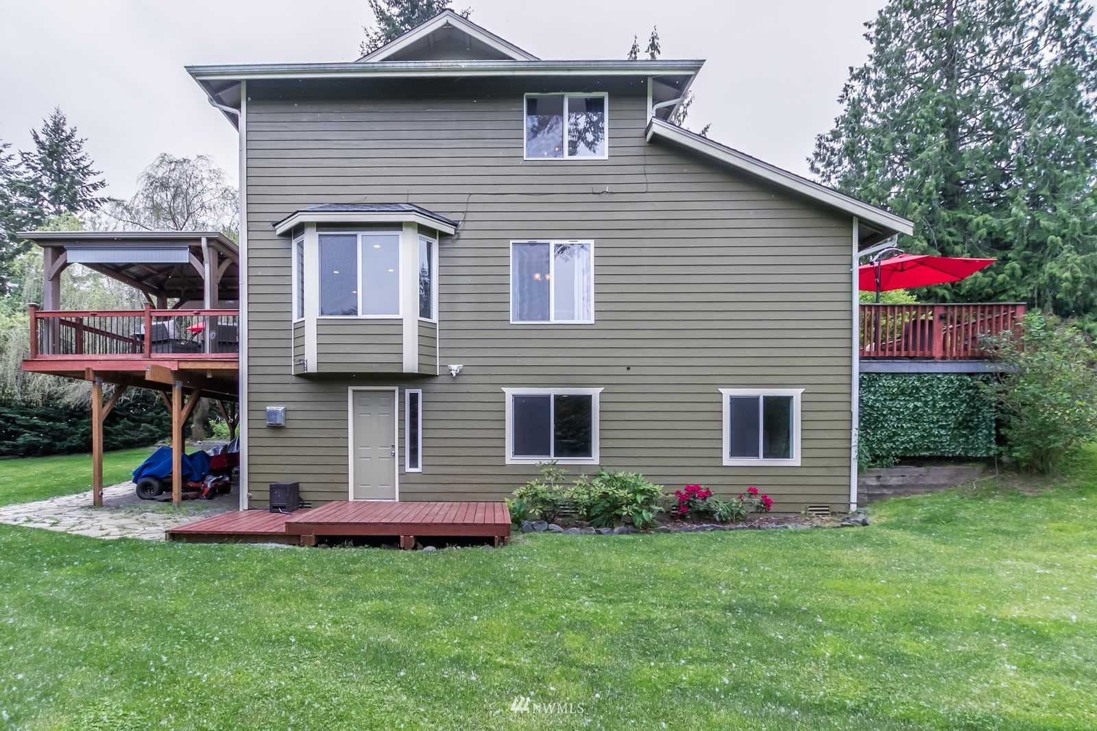 7413 Vandermark Road East Bonney Lake, WA 98391 - Photo 31 of 39 a front view of a house with plants