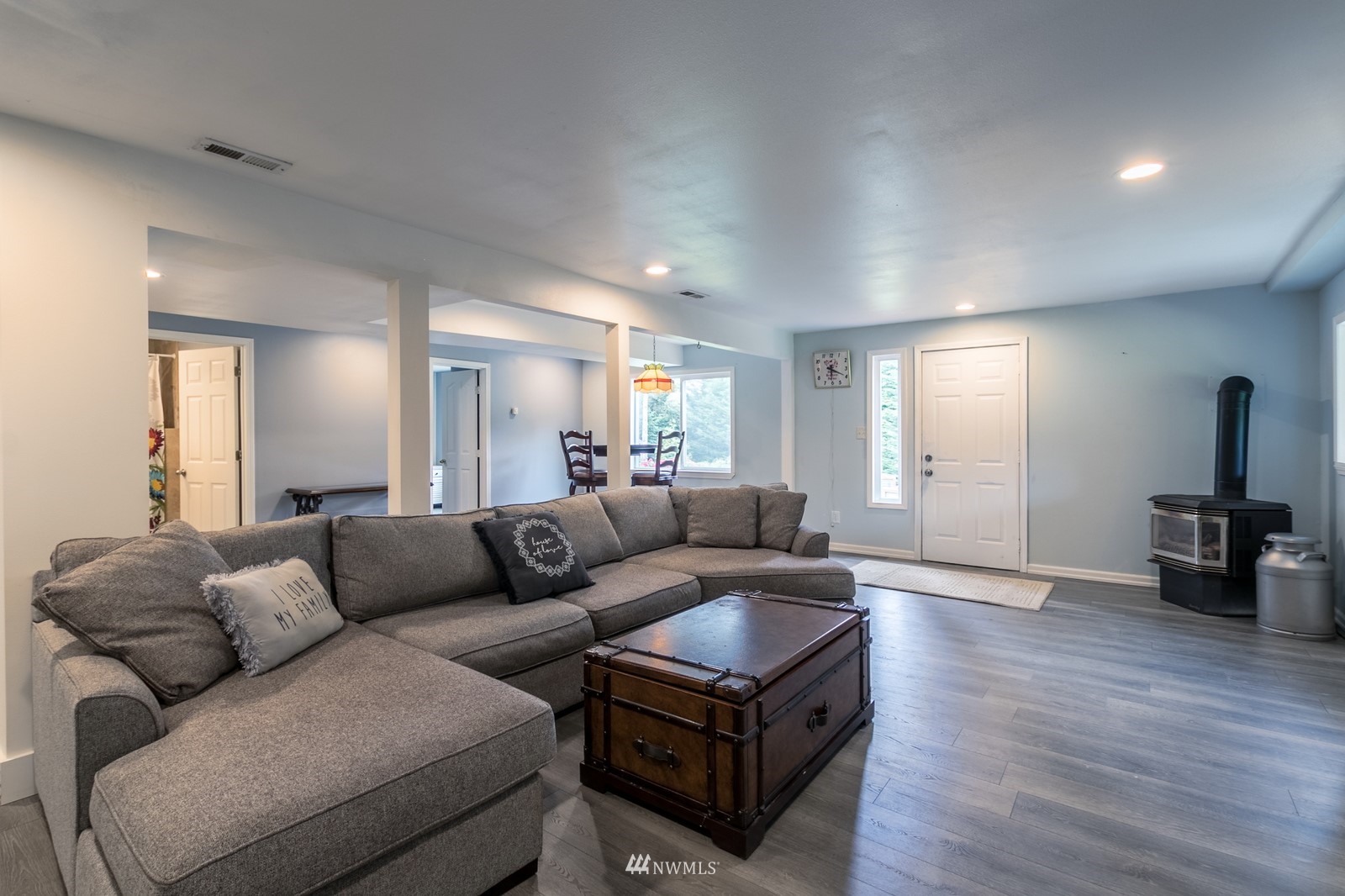 7413 Vandermark Road East Bonney Lake, WA 98391 - Photo 34 of 39 a living room with furniture and a wooden floor