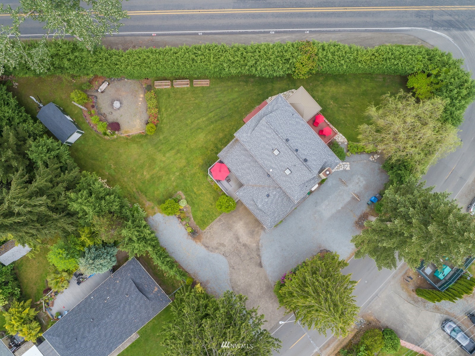 7413 Vandermark Road East Bonney Lake, WA 98391 - Photo 39 of 39 an aerial view of a house with a yard and lake view