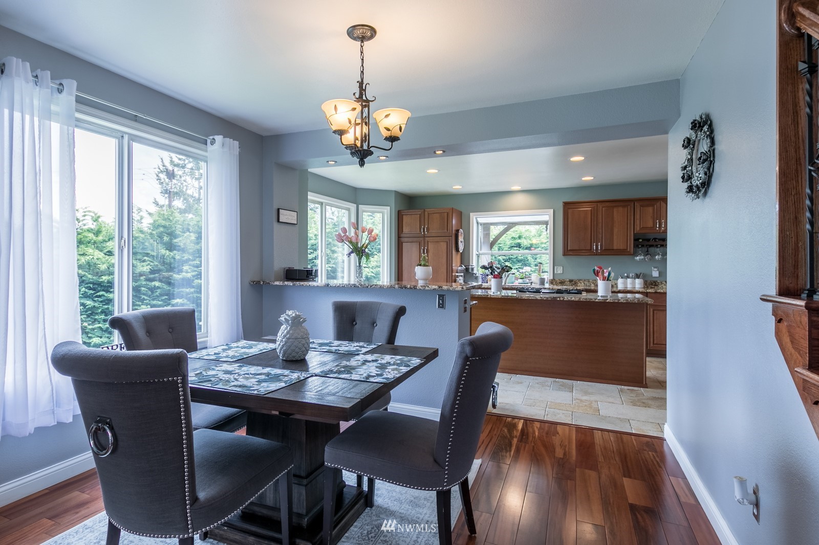 7413 Vandermark Road East Bonney Lake, WA 98391 - Photo 5 of 39 a view of a dining room with furniture window and wooden floor