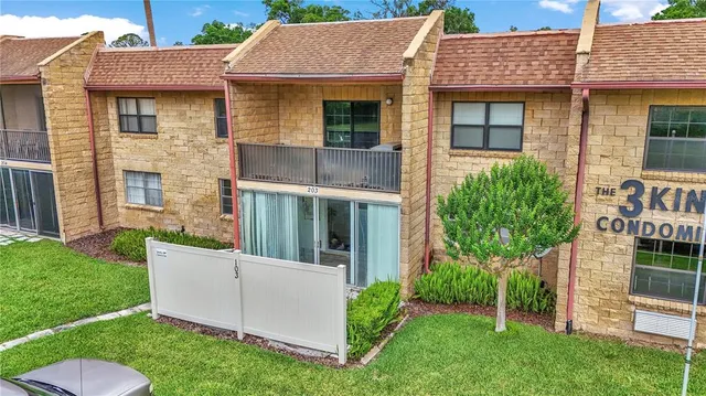 a view of a house with garden and yard