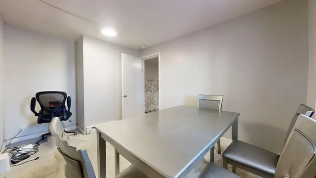 a view of a workspace with furniture