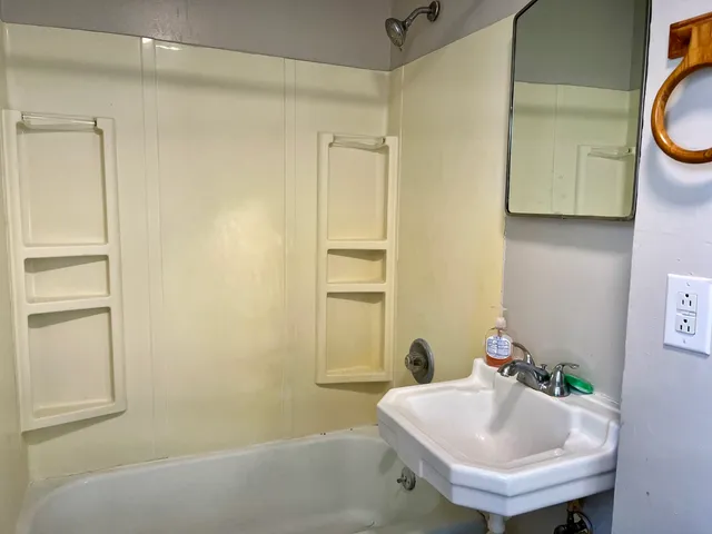 a bathroom with a sink and a mirror