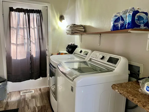 a utility room with dryer and washer