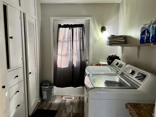 a utility room with closet dryer and washer