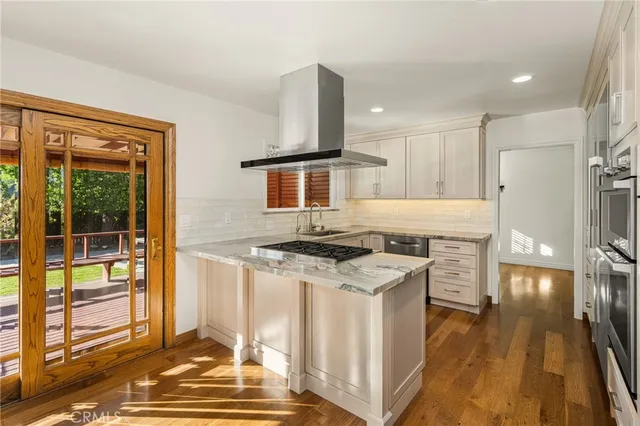 a kitchen with a stove and a refrigerator