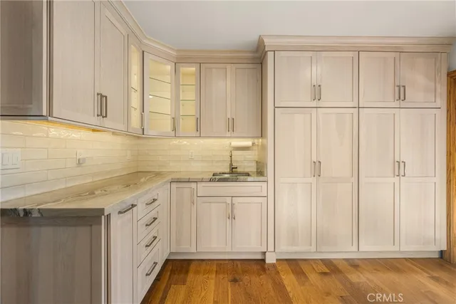 a kitchen with a sink and cabinets