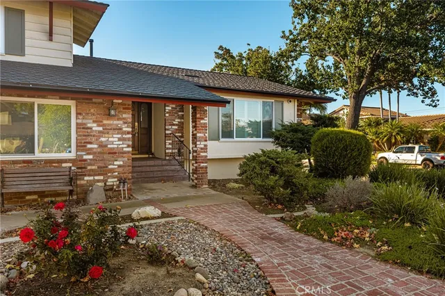 a view of a house with a garden