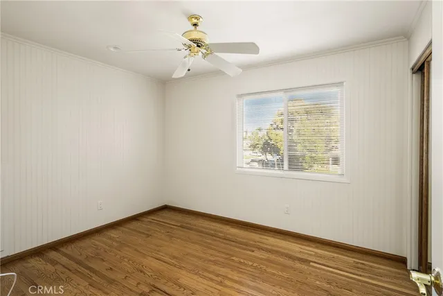 a view of hallway with wooden floor